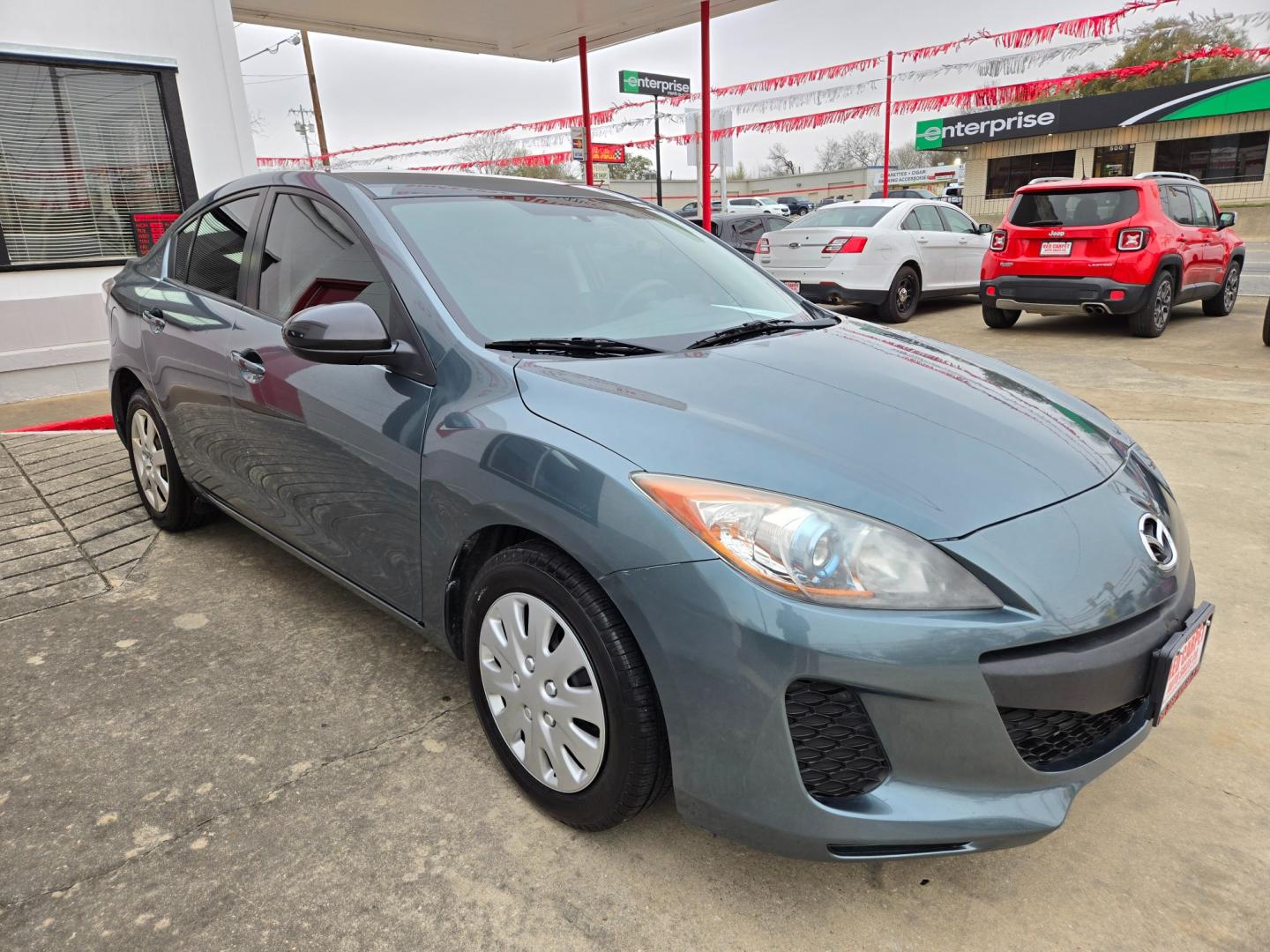 2013 Blue Mazda MAZDA3 (JM1BL1U78D1) with an 2.0L I4 F DOHC 16V engine, Automatic transmission, located at 503 West Court, Seguin, TX, 78155, (830) 379-3373, 29.568621, -97.969803 - Photo#1